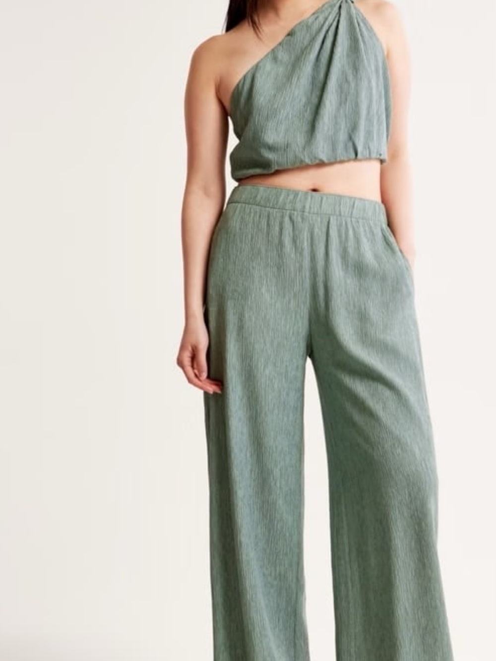 in Sage Green and pants-